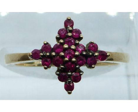 A 9ct gold ring set with rubies in a cluster, 2.6g, size M/N