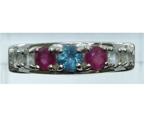 A 9ct white gold ring set with a topaz, rubies and paste, 4g, size O/P&nbsp;