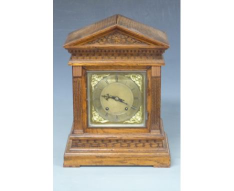 Oak-cased mantel clock with apex top, Roman silvered dial, Arabic minutes, cherub spandrels to corners and&nbsp;beetle and po