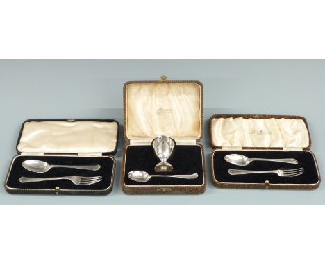 Two cased hallmarked silver fork and spoon sets and a cased hallmarked silver egg cup and spoon set, weight 128g