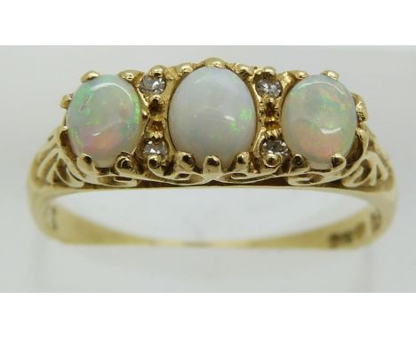 An 18ct gold ring set with three opals and diamonds, 3.6g, size P/Q