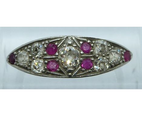 Art Deco 18ct gold ring set with seven old cut diamonds, the central diamond of approximately 0.22ct, and five rubies in a pl