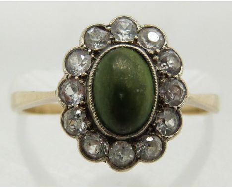 An 18ct gold ring set with turquoise cabochon surrounded by spinel, 2.1g, size L&nbsp;