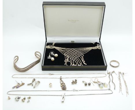 A silver necklace made up of spheres in a lattice pattern, silver necklaces, silver bangle etc