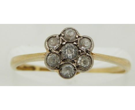 An 18ct gold ring set with white sapphires in a cluster, 2.1g, size size L