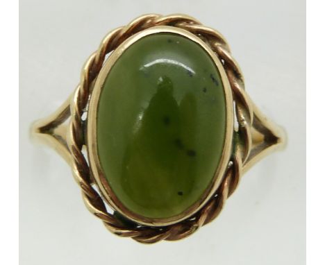 A 9ct gold ring set with nephrite jade cabochon, 4.1g, size P&nbsp;