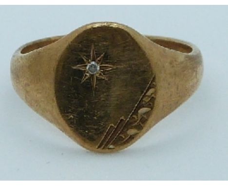 A 9ct gold signet ring set with a diamond, 5.1g, size S