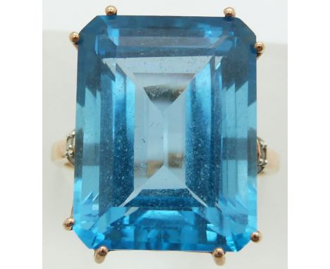 A 9ct gold ring set with an emerald cut treated blue topaz and diamonds, 8.4g, size Q&nbsp;