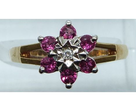 A 9ct gold ring set with a diamond and rubies, 3.2g, size N&nbsp;