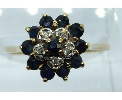 A 9ct gold ring set with sapphires and diamonds in a cluster, 2.6g, size O