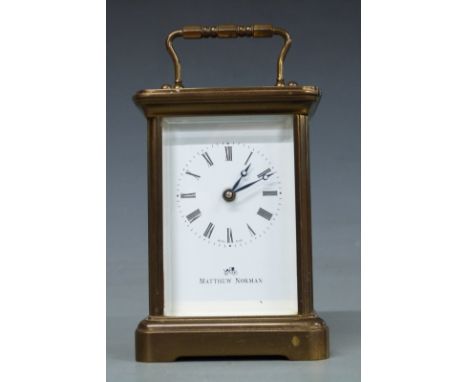 A 20thC brass carriage clock by Matthew Norman in corniche style case, the Roman enamel dial with Breguet style hands, Swiss 