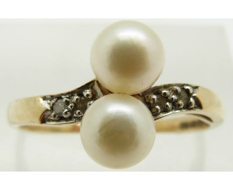 A 9ct gold ring set with two pearls and diamonds, 2.2g, size P/Q