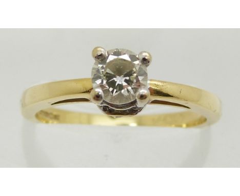 An 18ct gold ring set with a round brilliant cut diamond of approximately 0.4ct with further diamonds to the setting, 3.5g, s