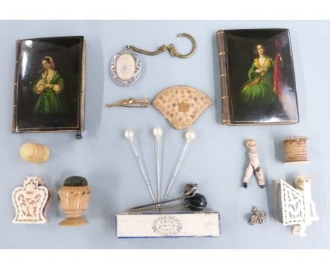 A pair of 19thC continental lacquer notebooks, pin cushions, Victorian knot stick pin, early piece of needle work, 9ct gold h