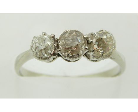 An 18ct white gold ring set with three old cut diamonds, 2g, size N