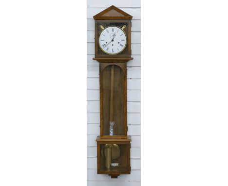 Hermle German three train chiming regulator wall clock in oak case with apex top and glass panels to three sides, the Roman e