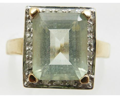 A 9ct gold ring set with an aquamarine and diamonds, 3.4g, size M