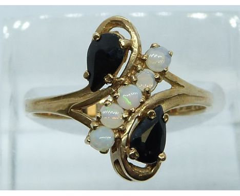 A 9ct gold ring set with sapphires and opals, 2.5g, size P