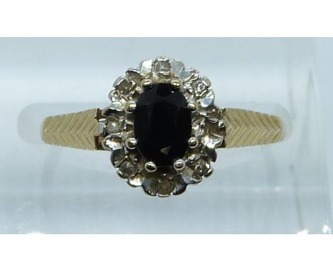 A 9ct gold ring set with a sapphire and diamonds, 2g, size M