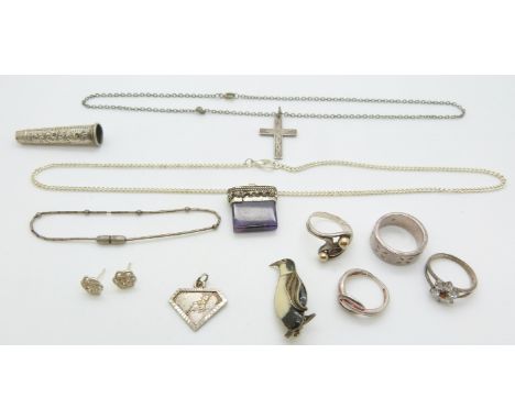 A collection of silver jewellery including enamel penguin brooch, four rings, necklaces etc