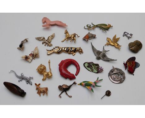 A collection of brooches including enamel and marcasite horse, lizard, enamel frog, Sphinx horse, lion, birds etc