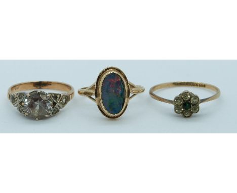 A 9ct gold ring set with opal doublet and two 9ct gold rings set with paste, 6g