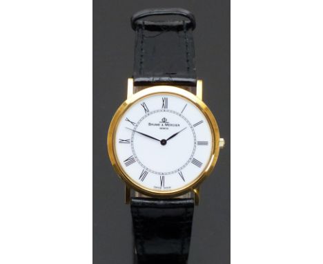 Baume &amp; Mercier 18ct gold wristwatch ref. 15605 with black hands and Roman numerals, white dial and quartz movement, on b