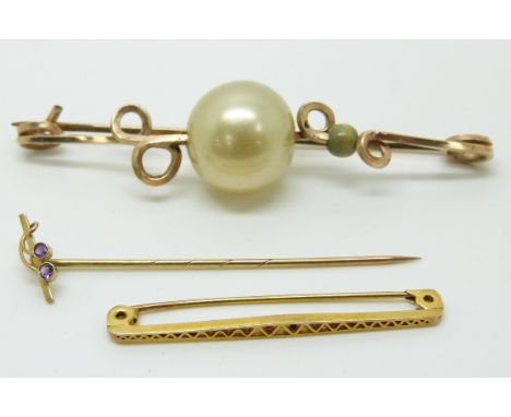 A 9ct gold brooch, a 9ct gold stick pin set with amethyst (2.2g) and a gold plated brooch