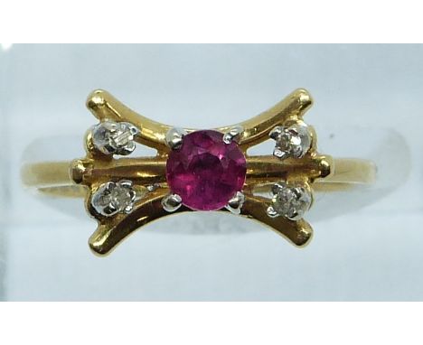 An 18ct gold ring set with a ruby and diamonds, 3.3g, size M/N