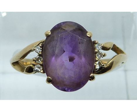 A 9ct gold ring set with an amethyst and diamonds, 3.2g, size Q/R