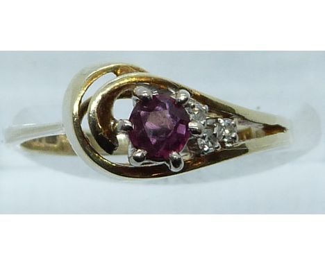 A 9ct gold ring set with a ruby and diamonds, 3g, size M