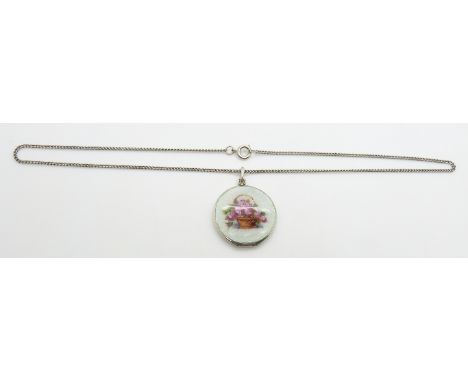 A silver locket set with blue guilloché&nbsp;enamel, 3cm diameter