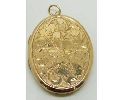 A 9ct gold locket with engraved floral decoration and engine turned back, 17.7g&nbsp;