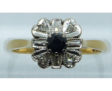 An 18ct gold ring set with a sapphire and diamonds in a platinum setting, 3.5g, size N&nbsp;