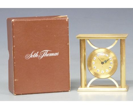 Seth Thomas French-made brass cased boudoir alarm clock, the gilt dial with Roman cartouche figures, luminous indicators and 