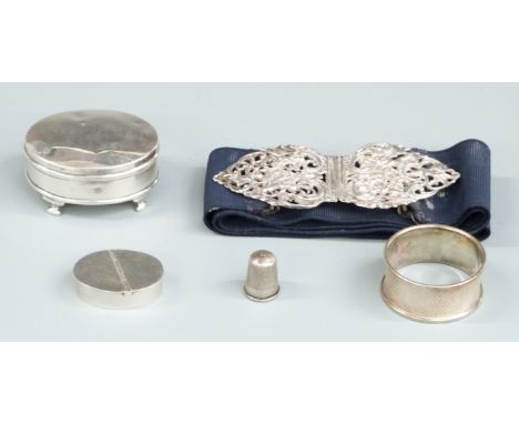 Hallmarked silver belt buckle, hallmarked silver trinket pot raised on four feet, silver napkin ring, Victorian hallmarked si