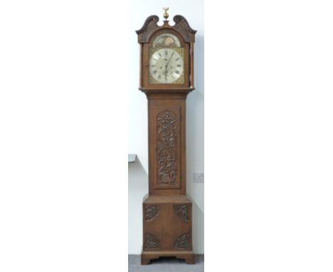 A 19thC English oak 8-day duration longcase clock with carved decoration, the silvered Roman 12inch dial with Arabic minutes 