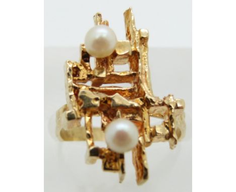 A 9ct gold ring set with two pearls in a bespoke design, 4.1g, size I/J