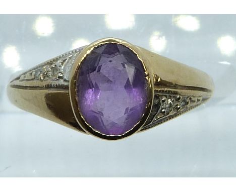 A 9ct gold ring set with an oval amethyst and diamonds, 2.6g, size N