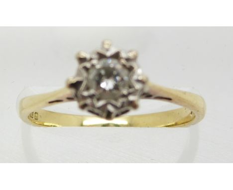 An 18ct gold ring set with a diamond of approximately 0.25ct in an illusion setting, 2.8g, size M/N