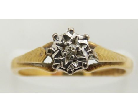An 18ct gold ring set with a diamond in an illusion setting, 2.7g, size J/K
