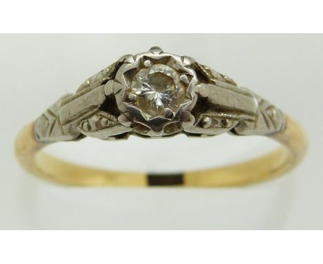 An 18ct gold ring set with a diamond in a platinum setting, 2.9g, size O/P