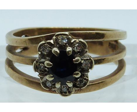 A 9ct gold ring set with a sapphire and diamonds, 3.6g, size J/K&nbsp;