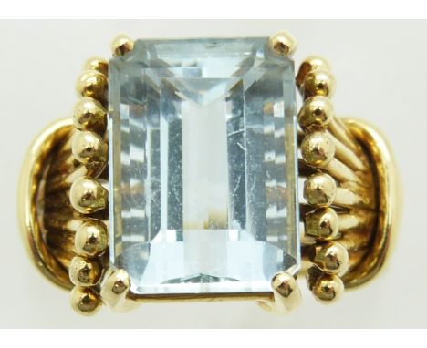 An 18k gold ring set with an emerald cut aquamarine, bought from Brazil, 7.2g, size K&nbsp;