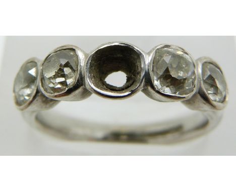 An 18ct white gold ring set with four old cut diamonds of approximately 0.33ct each, 6g, size O