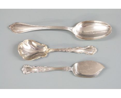 Three pieces of American white metal cutlery comprising table spoon, caddy or sugar scoop and a serving knife, length of long