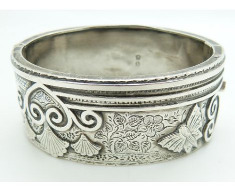 Victorian silver bangle with engraved and embossed decoration depicting a butterfly, Birmingham 1880