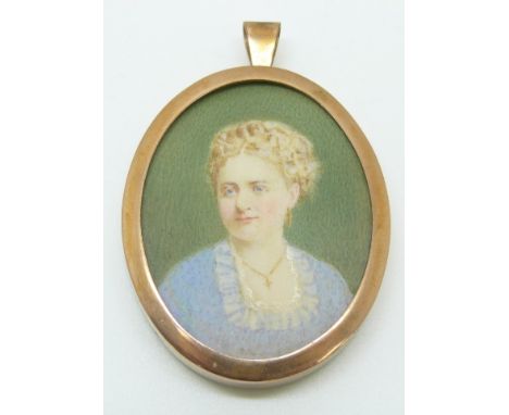 A yellow metal pendant set with a portrait miniature of a young woman, in original box&nbsp;