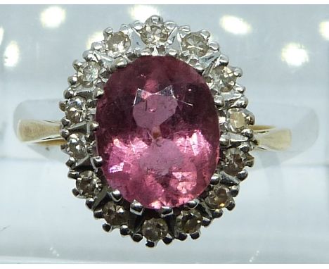 An 18ct gold ring set with pink tourmaline and diamonds, 4.3g, size L