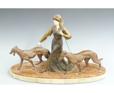 Art Deco figurine of a lady walking two hunting dogs, possibly R Scali, raised on a two tone alabaster plinth, W72 D21 H49cm&